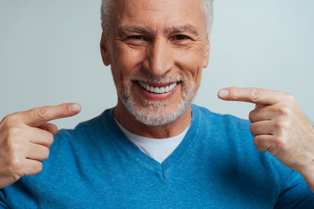 Senior Man with Healthy Smile - Dentist in South Gate, CA A smiling older man proudly shows off his healthy teeth, proof that quality dental care is ageless. - Dentist in South Gate, CA